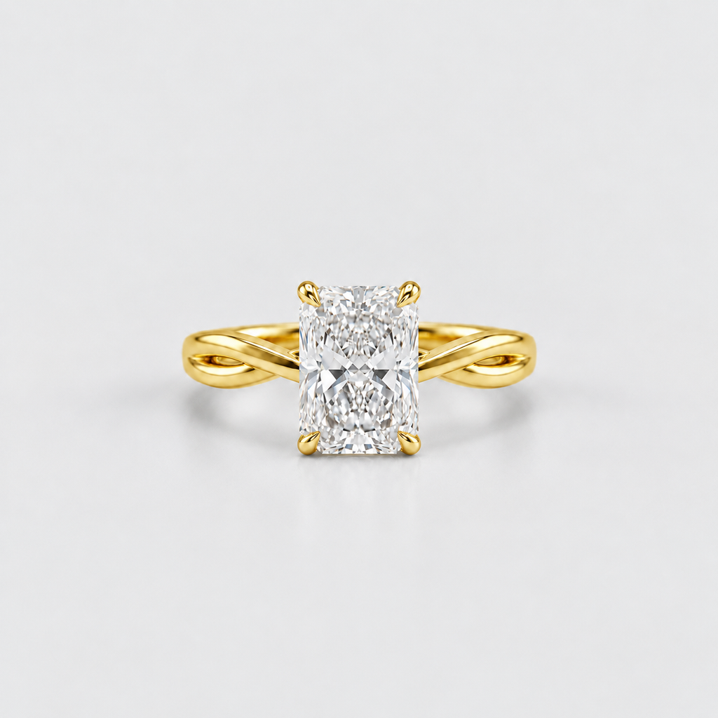 A yellow gold ring with a brilliant cut diamond center stone, set on a clean light gray background.