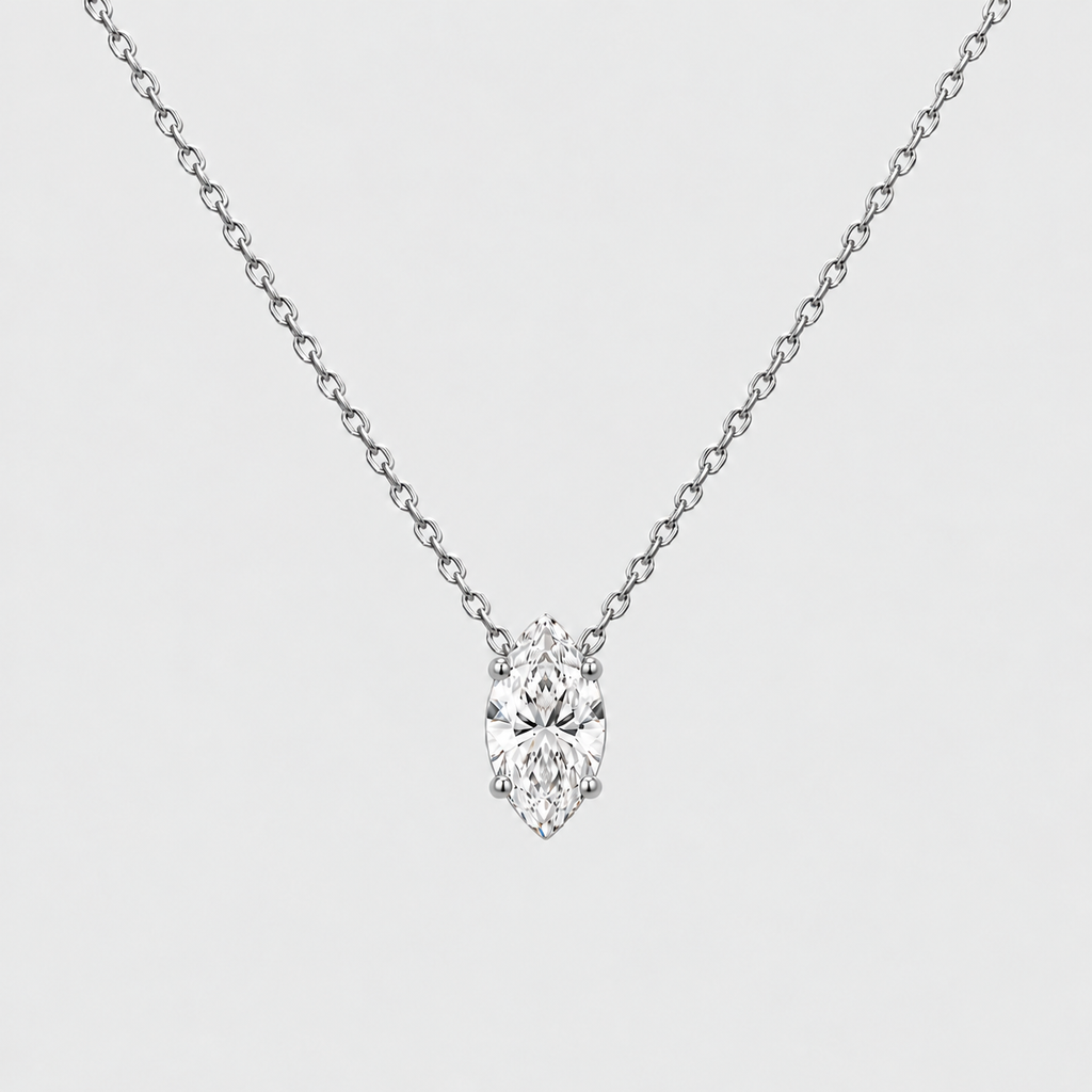 A silver-tone chain necklace with a single marquise-cut diamond pendant, shown against a light gray background.