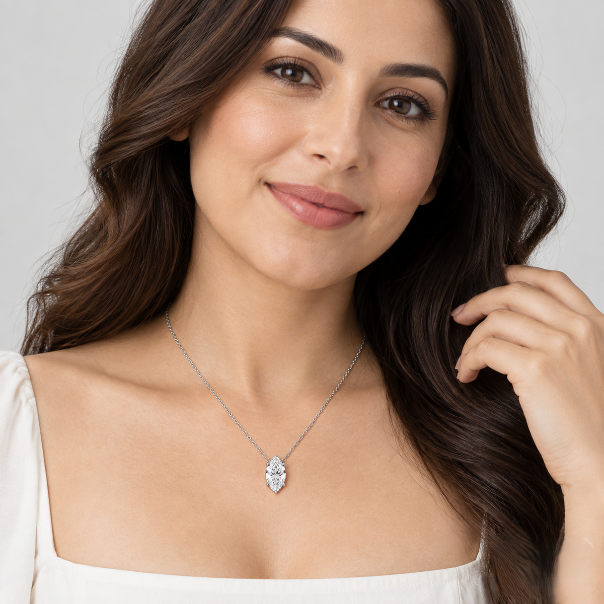 A Model Wear silver-tone chain necklace with a single marquise-cut diamond pendant.