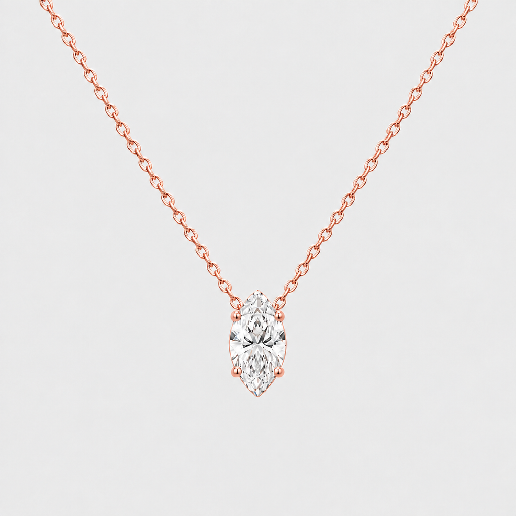 A rose gold necklace with a marquise-cut diamond pendant, shown against a light gray background.