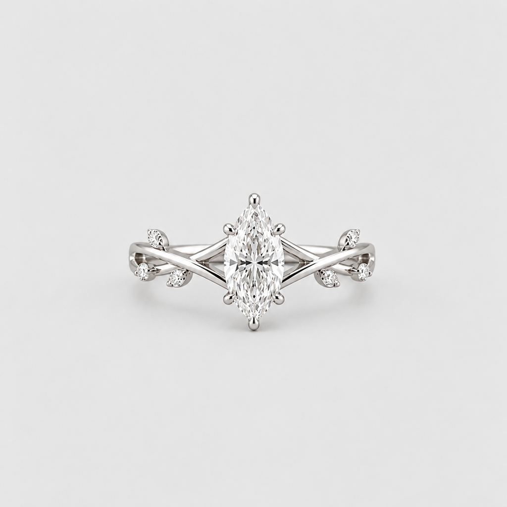 An elegant silver-tone ring featuring a marquise-cut center stone in a six-prong setting, flanked by delicate twisted band details and small accent stones, shown on a light gray background.