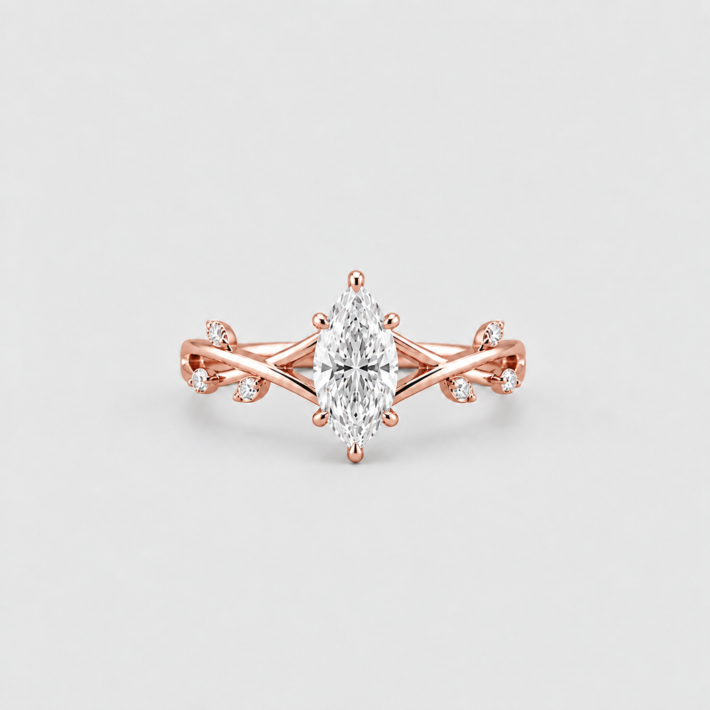 Rose gold ring with a marquise-cut center stone and small accent stones on a clean light gray background.