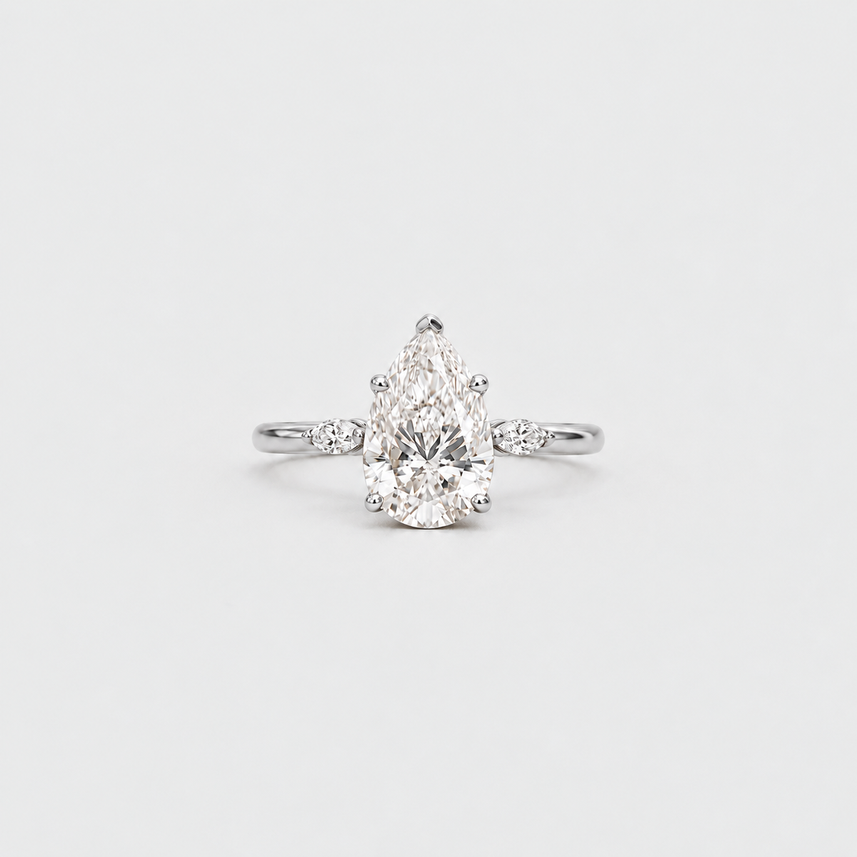 3.10 Ct. Lab Grown Diamond Pear & Marquise Three Stone Ring (VS-EF)