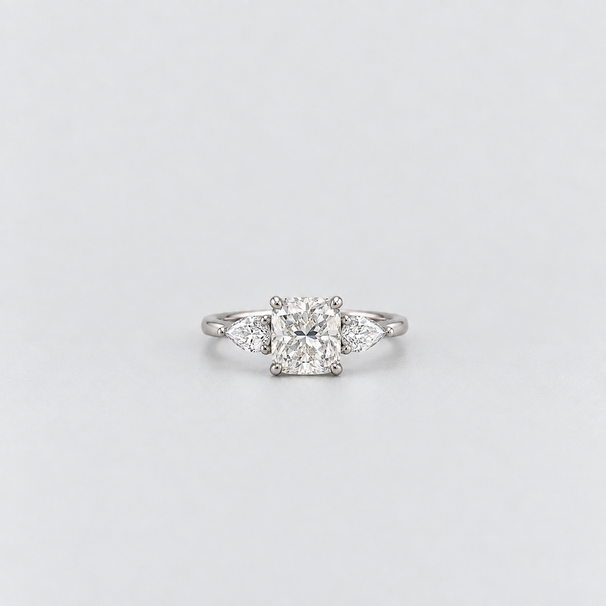 2.40 Ct. Lab Grown Diamond Cushion & Pear Cut Three Stone Ring (VS-EF)