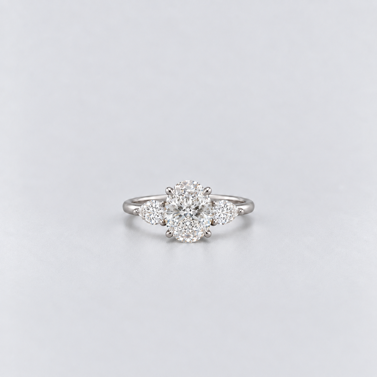 1.30 Ct. Lab Grown Diamond Oval & Pear Three Stone Ring (VS-EF)