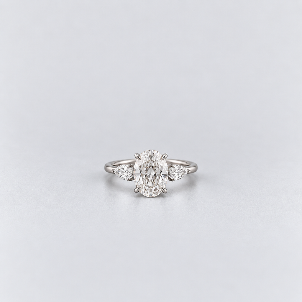 2.50 Ct. Lab Grown Diamond Oval & Pear Three Stone Ring (VS-EF)