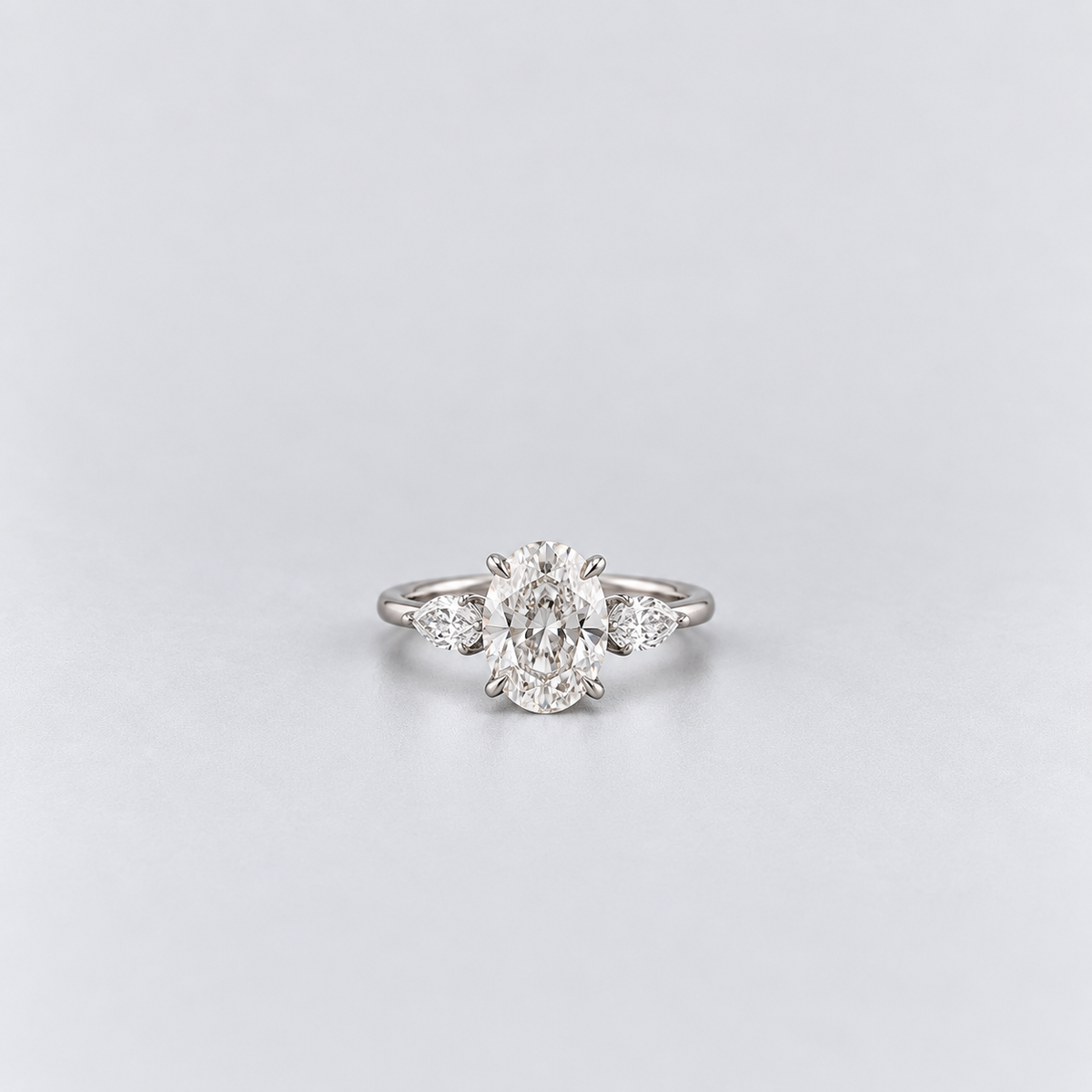 2.50 Ct. Lab Grown Diamond Oval & Pear Three Stone Ring (VS-EF)