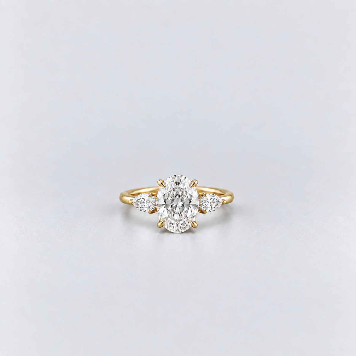 2.50 Ct. Lab Grown Diamond Oval & Pear Three Stone Ring (VS-EF)