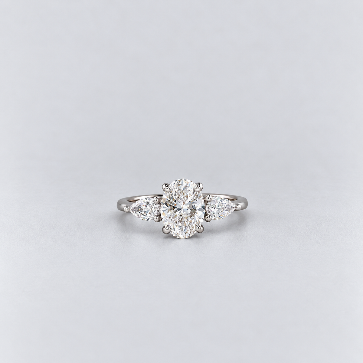 1.50 Ct. Lab Grown Diamond Three Stone Ring Oval & Pear Cut (VS-EF)