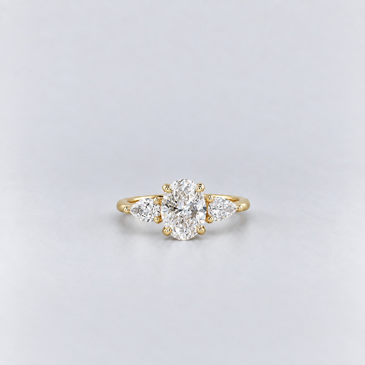 1.50 Ct. Lab Grown Diamond Three Stone Ring Oval & Pear Cut (VS-EF)