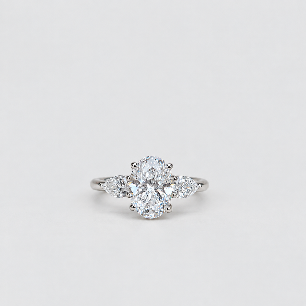 1.50 Ct. Lab Grown Diamond Three Stone Ring Oval & Pear (VS-EF)