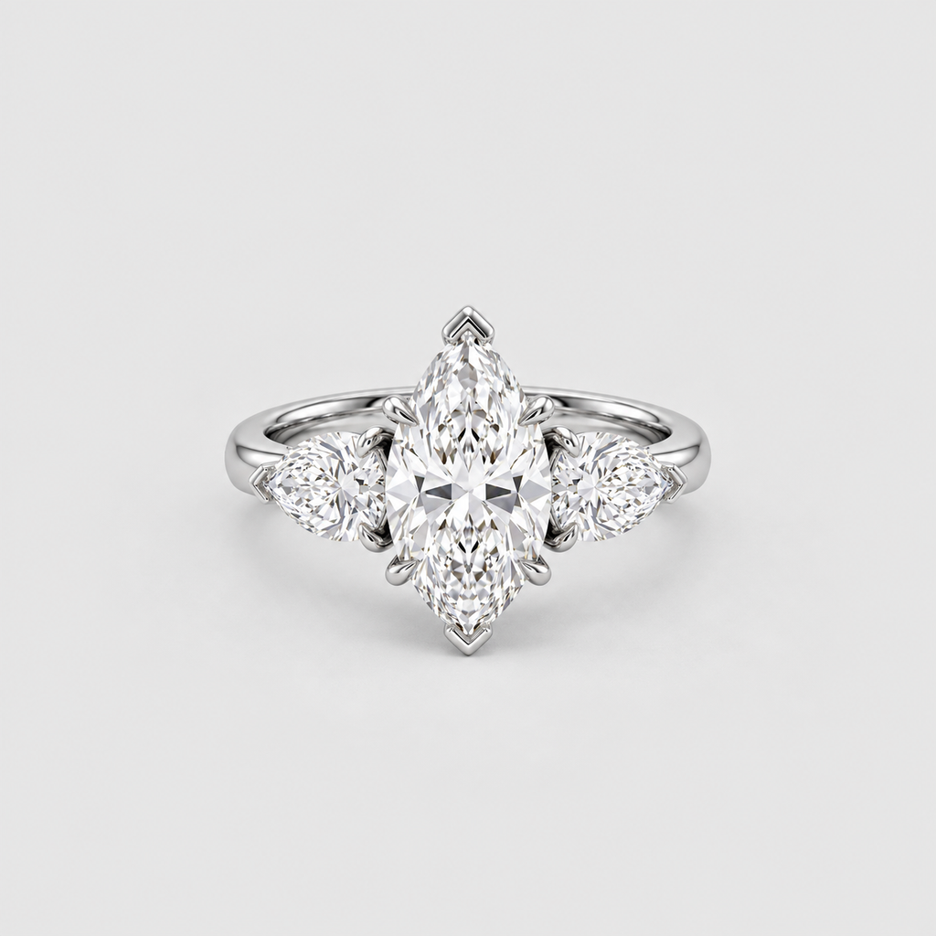 A silver-toned diamond ring featuring a marquise-cut center stone with three smaller round diamonds flanking it, set against a light gray background.