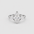 A silver-toned diamond ring featuring a marquise-cut center stone with three smaller round diamonds flanking it, set against a light gray background.