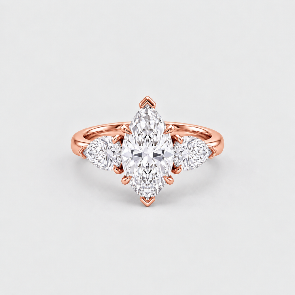 A rose gold ring featuring a marquise-cut center diamond flanked by two round diamonds on a clean, light gray background.