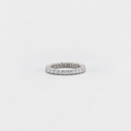 A slim silver eternity ring paved with small round-cut clear stones, centered on a seamless light gray background.