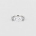 A silver double-row diamond eternity ring with a center round diamond, set against a clean light gray background.