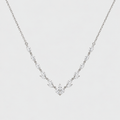 A delicate silver-toned necklace featuring a V-shaped arrangement of marquise-cut clear stones on a fine chain, set against a plain light gray background.