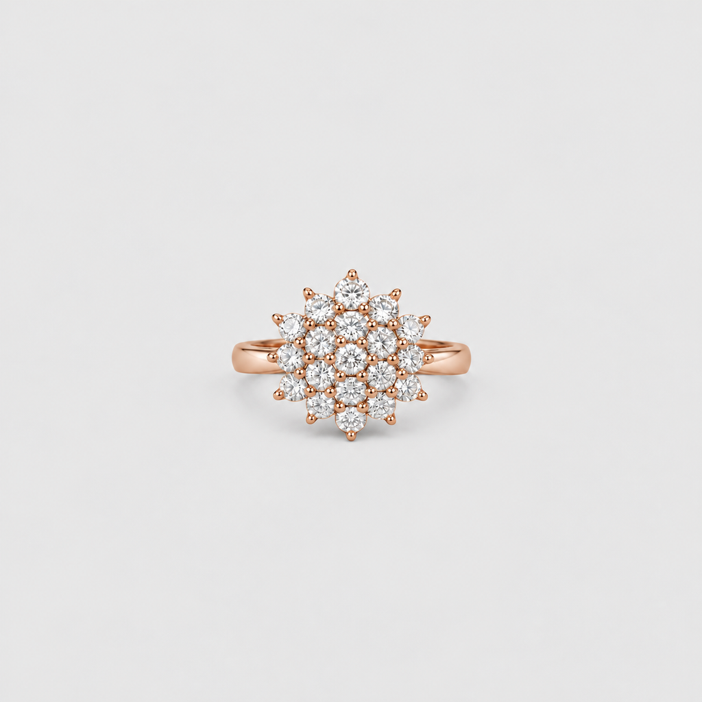 A rose gold ring with a multi-stone cluster setting featuring clear round-cut diamonds, presented on a light gray background.