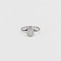 A silver ring with an oval pavé diamond setting on a plain light gray background.