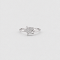 A silver ring featuring a star-shaped pavé setting with a smaller star layered behind it, shown on a light gray background.