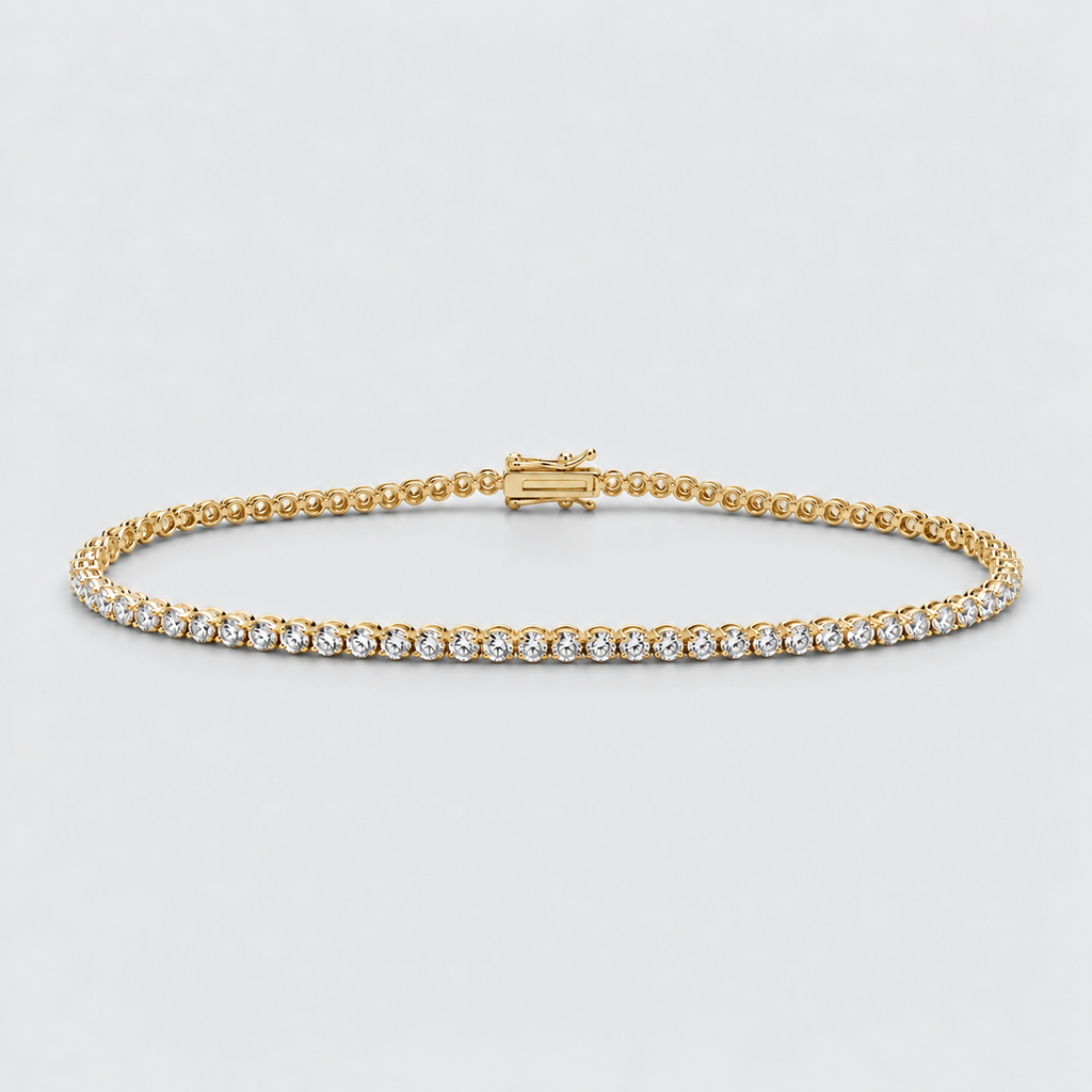 A yellow gold tennis bracelet with a row of small clear round-cut stones, displayed on a light gray background.