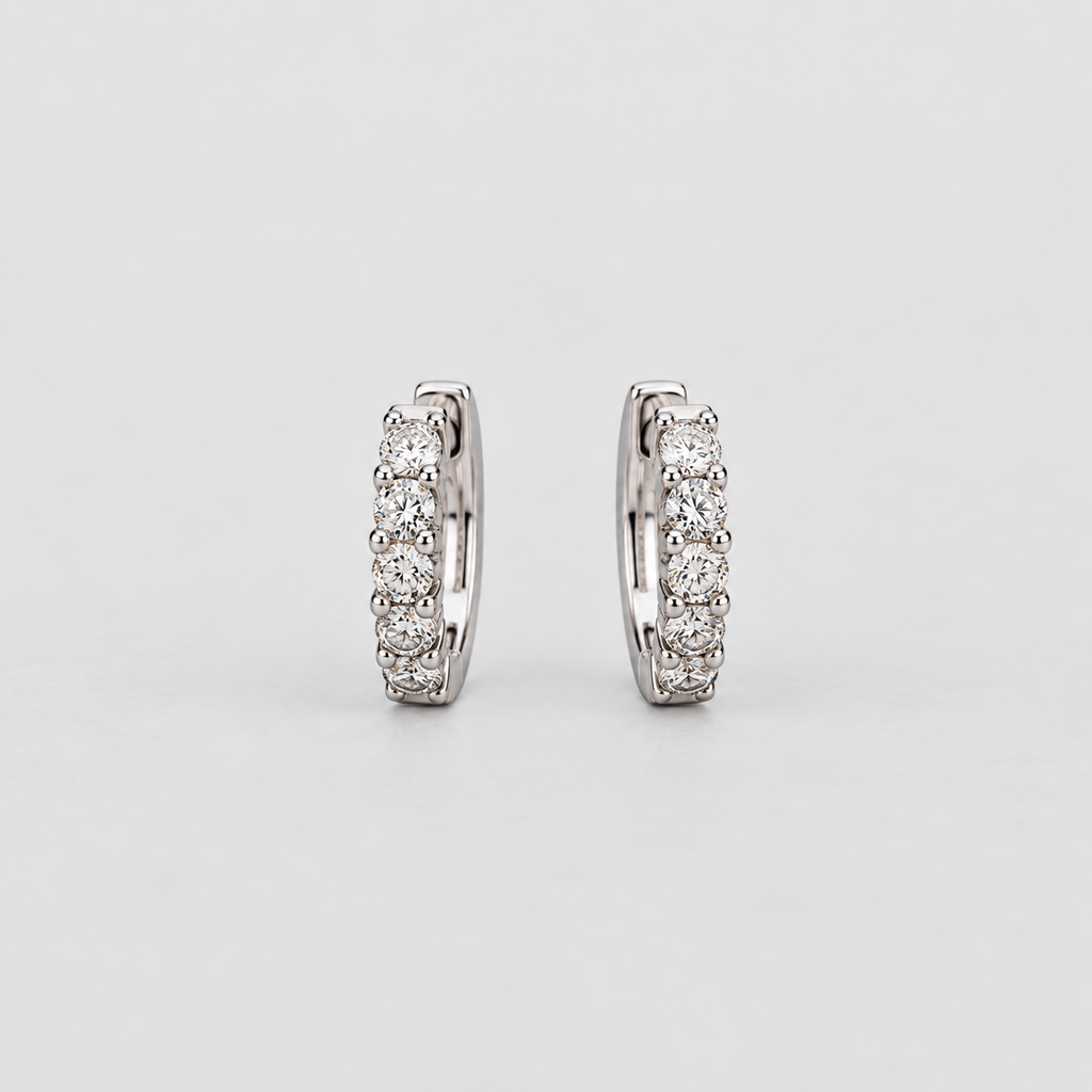 Elegant white gold huggie earrings with a graduated row of sparkling round cut lab grown diamonds