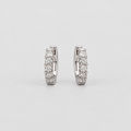 Elegant white gold huggie earrings with a graduated row of sparkling round cut lab grown diamonds