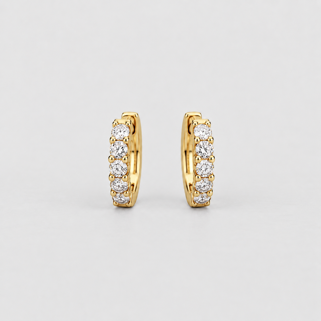 Classic yellow gold huggie earrings with a graduated row of sparkling round cut lab grown diamonds