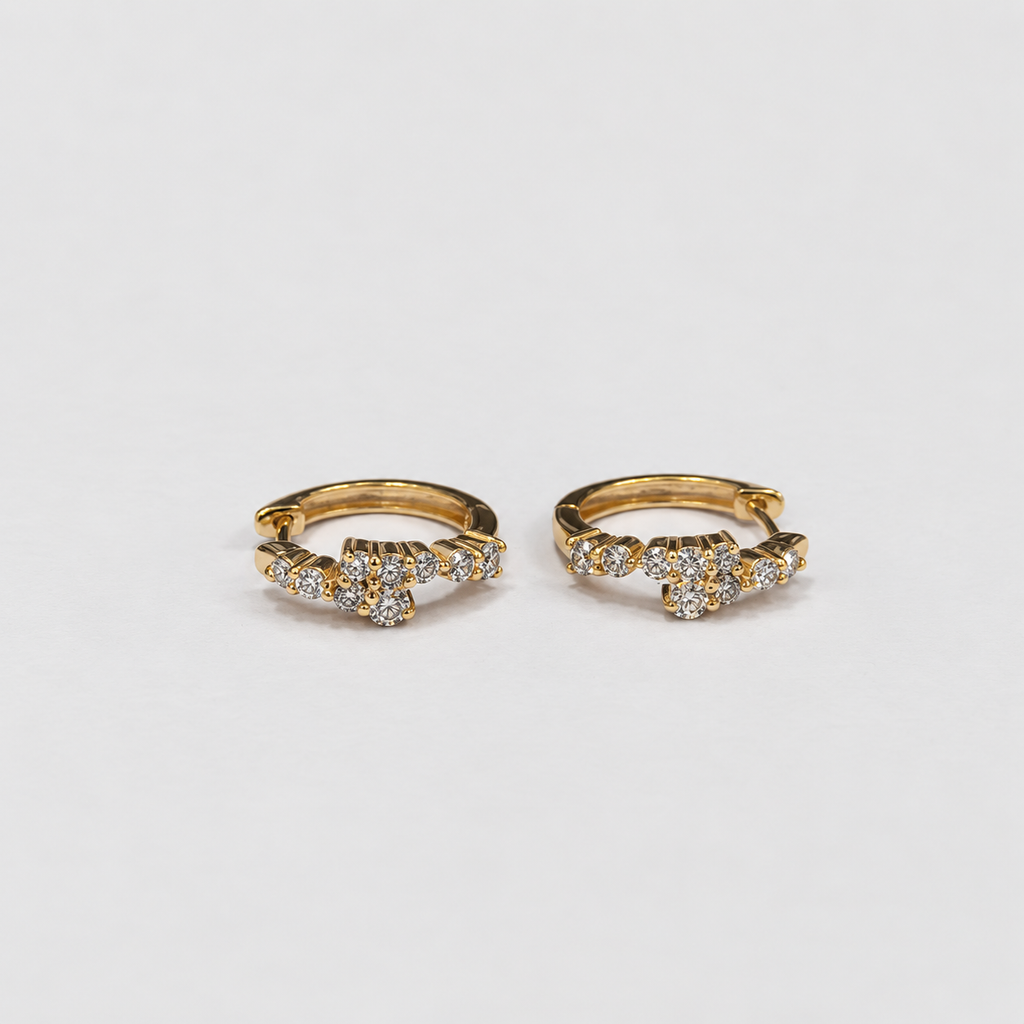 Lab grown diamond cluster huggie hoop earrings in yellow gold with round cut diamonds, top-down view