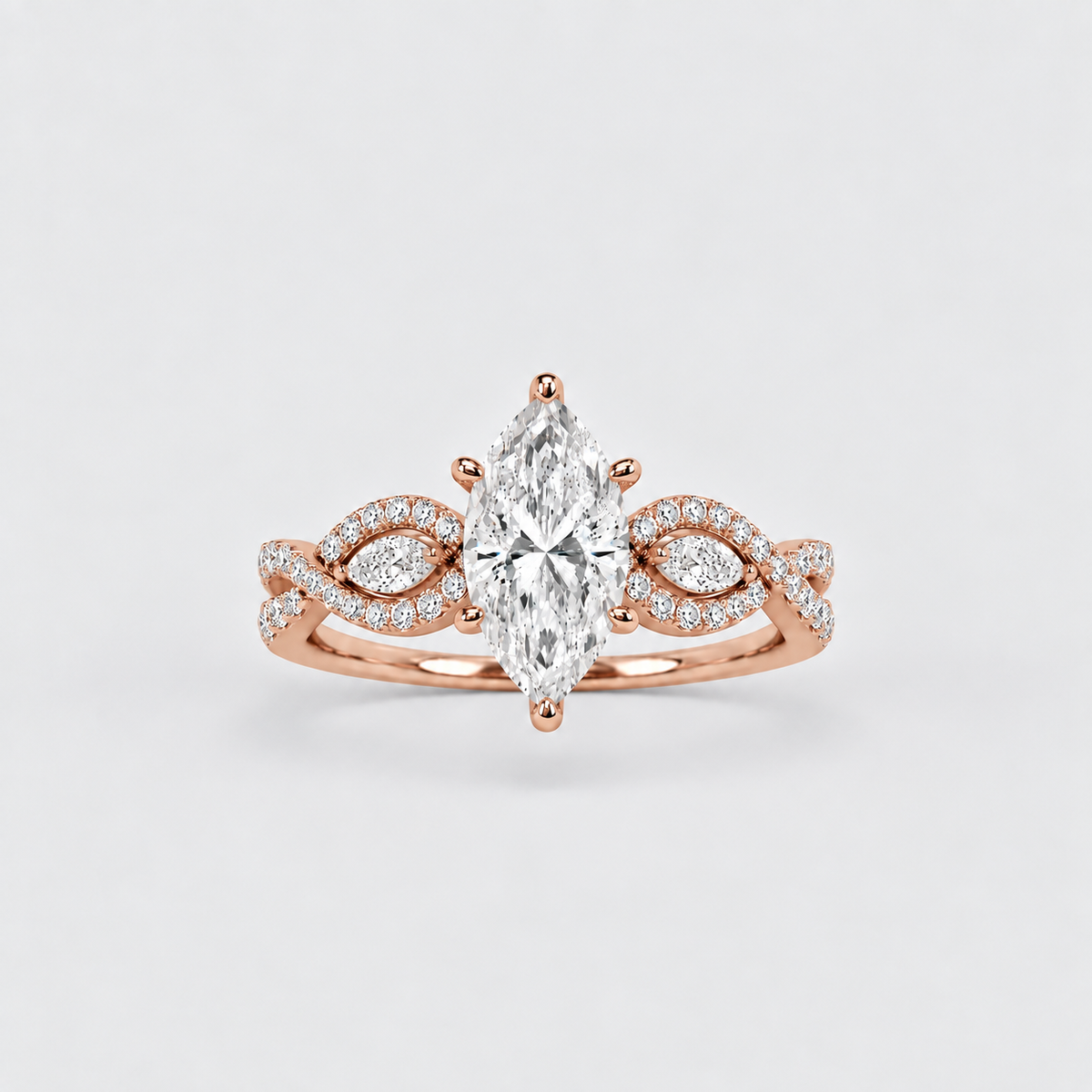 A rose gold ring with a marquise-cut diamond center stone and pavé-set diamonds along a twisted band, shown on a light gray background.