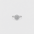 Women's white gold diamond cluster engagement ring with flower pattern band