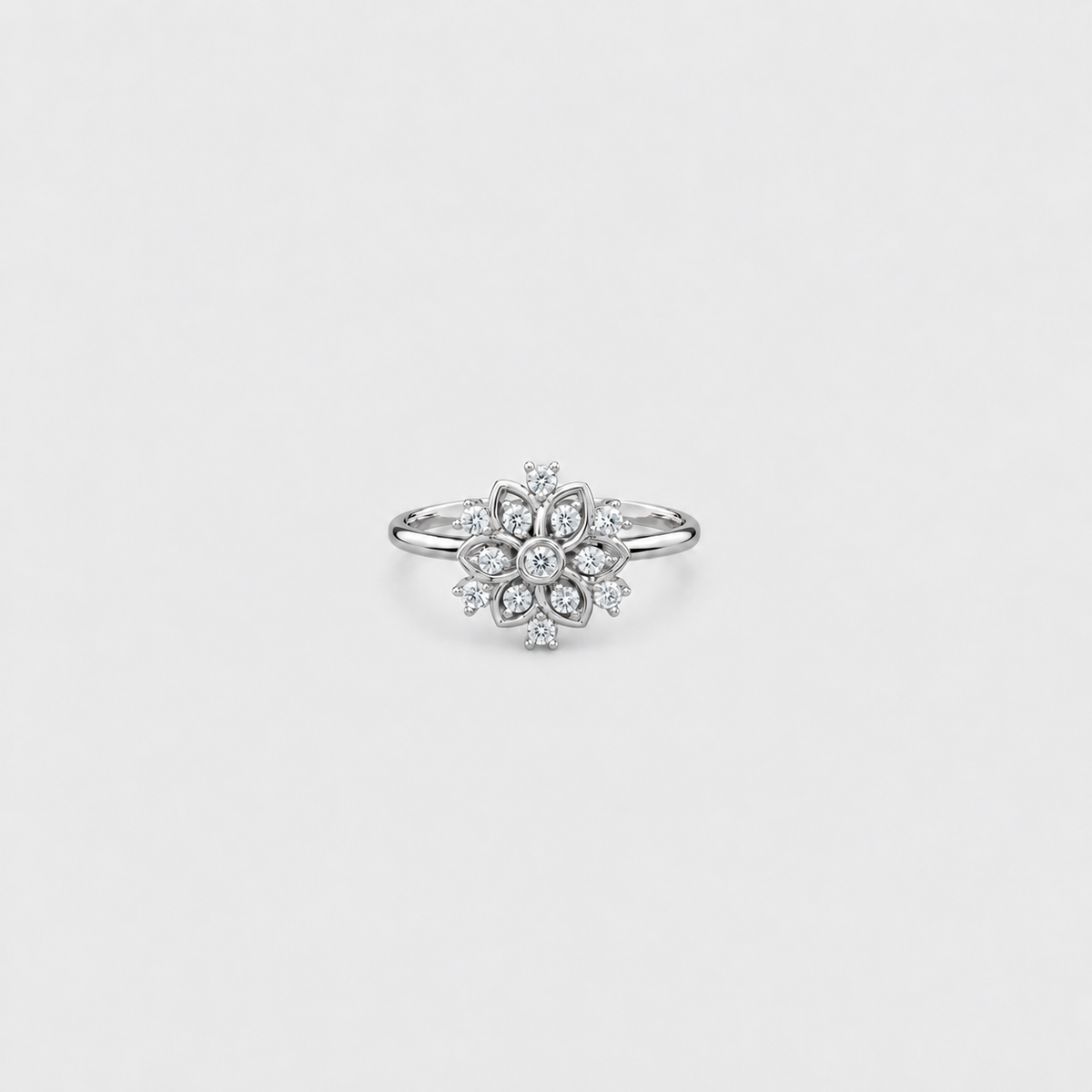 Women's white gold diamond cluster engagement ring with flower pattern band