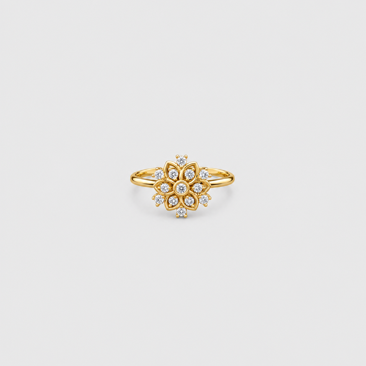 Women's cluster diamond ring in a yellow gold flower setting