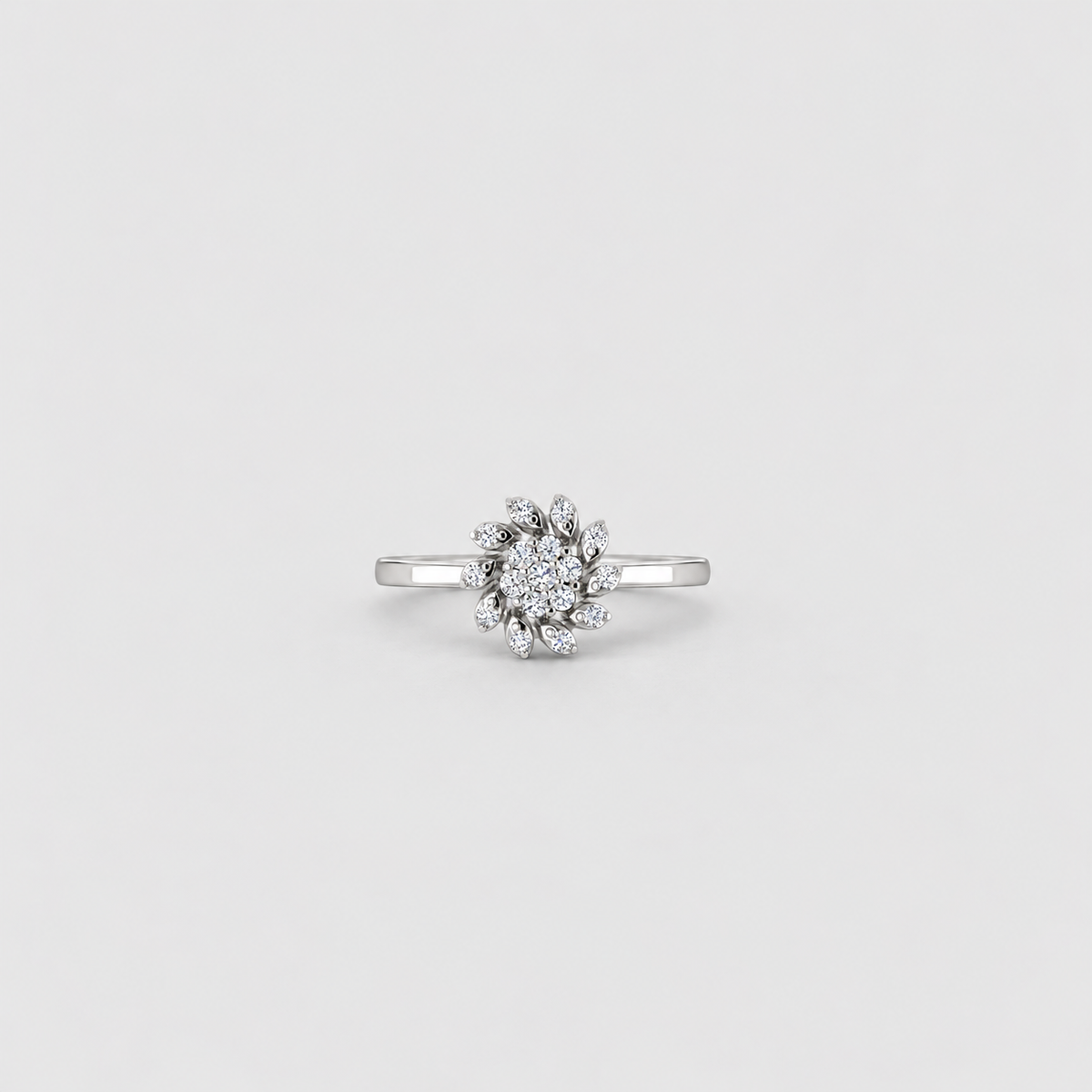 Women's white gold diamond cluster ring with a split shank band