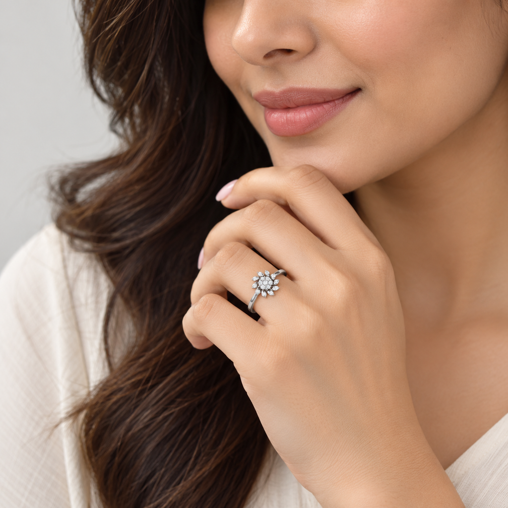 Women's diamond cluster ring in white gold worn on a finger