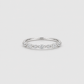 A delicate silver band ring featuring a row of small marquise-cut and round-cut clear stones across the top, photographed on a clean light gray background.