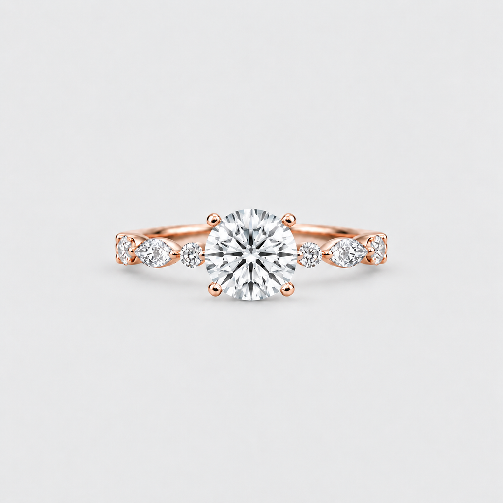 A rose gold engagement ring featuring a round-cut center diamond flanked by marquise-cut side diamonds on a clean, light gray background.
