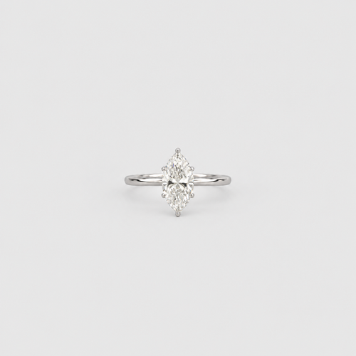 A silver-tone ring featuring a marquise-cut diamond set in a four-prong setting, centered on a light gray background.