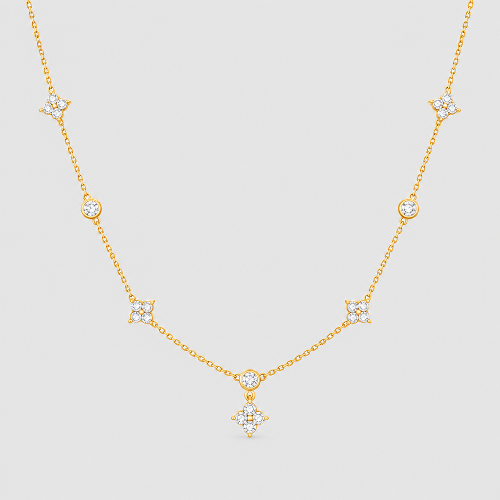 A delicate gold chain necklace featuring multiple small star and crescent moon motifs set with clear stones, displayed against a solid light gray background.