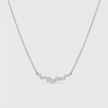A delicate silver chain necklace featuring a small, wavy cluster of clear gemstones at the center, displayed against a light gray background.