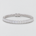 A tennis bracelet featuring marquise-cut clear stones in a silver-toned setting, arranged in a continuous row with a rectangular clasp, shown on a light gray background.