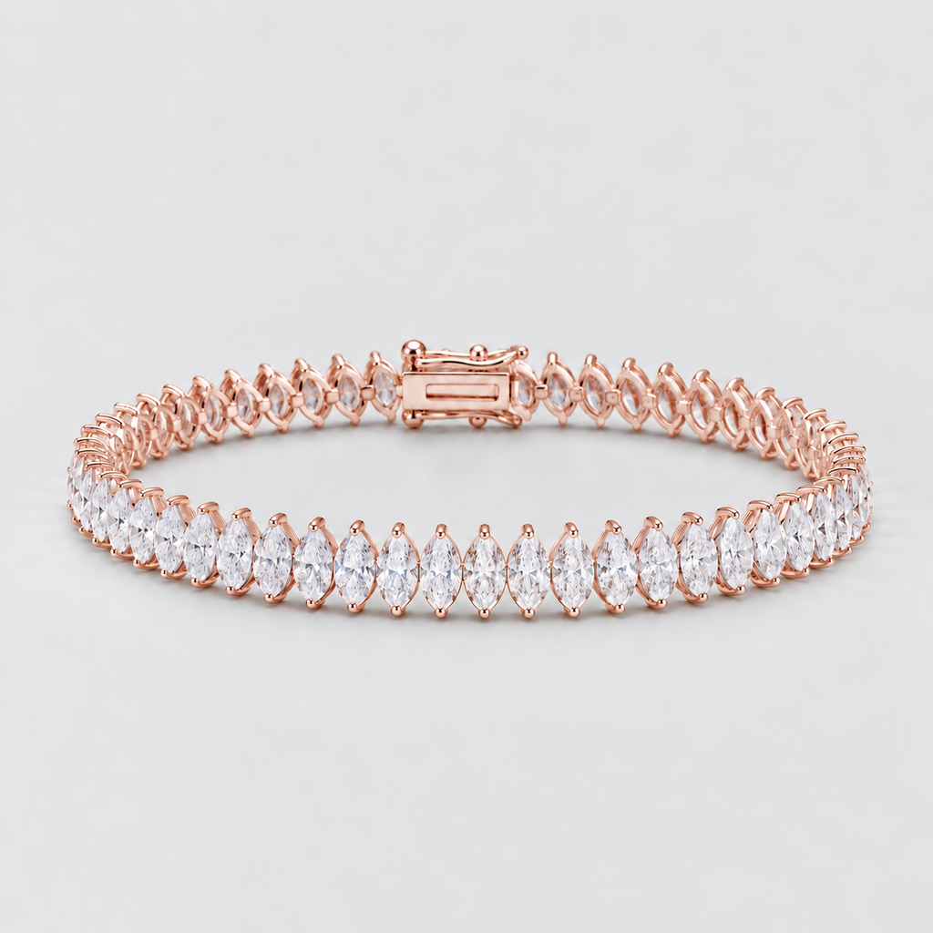 A rose gold tennis bracelet featuring a row of marquise-cut clear gemstones, displayed on a clean light gray background.