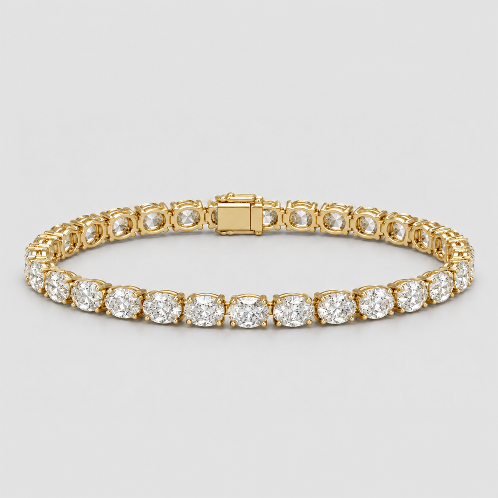 A yellow gold tennis bracelet set with round brilliant-cut diamonds, shown on a neutral light gray background.