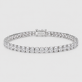 A diamond tennis bracelet with a row of round-cut diamonds and a baguette clasp, shown on a light gray background.