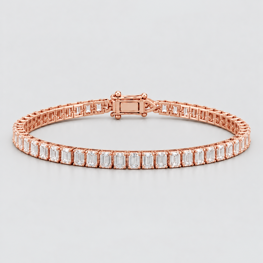 A rose gold tennis bracelet featuring baguette-cut clear stones, displayed on a neutral light gray background.